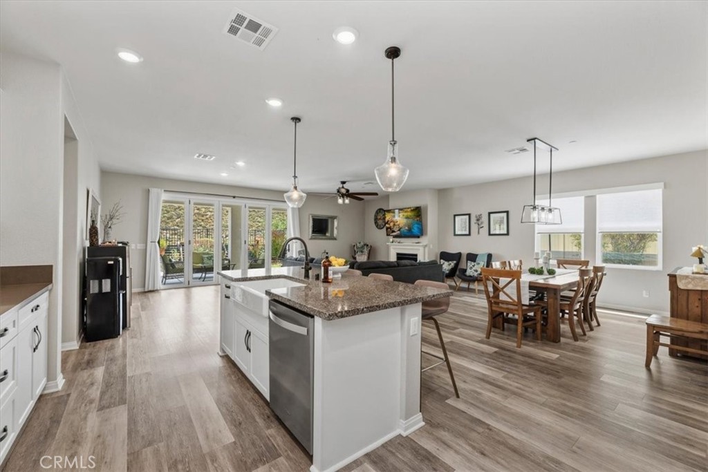 32937 Marin Fields Road Winchester, CA 92596 - Photo 7 of 47 a open kitchen with stainless steel appliances granite countertop a stove and refrigerator