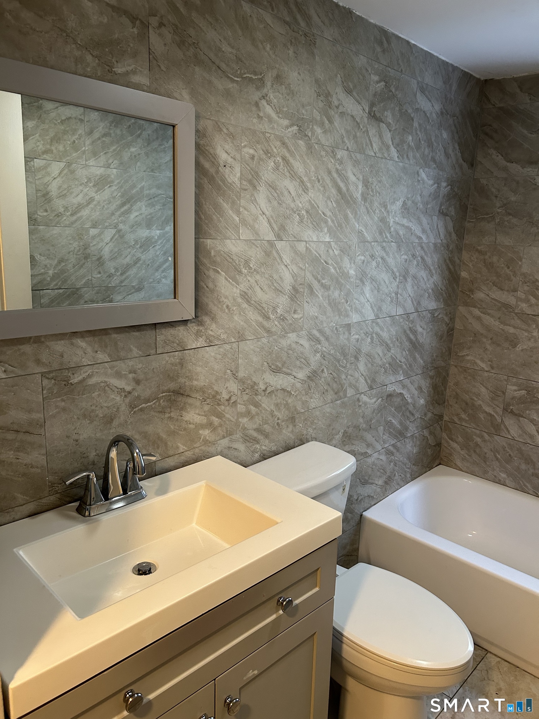 240 Scott Street Naugatuck, CT 06770 - Photo 4 of 10 a bathroom with a sink a toilet and bathtub