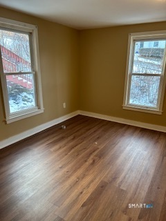 240 Scott Street Naugatuck, CT 06770 - Photo 9 of 10 a view of an empty room with wooden floor and a window