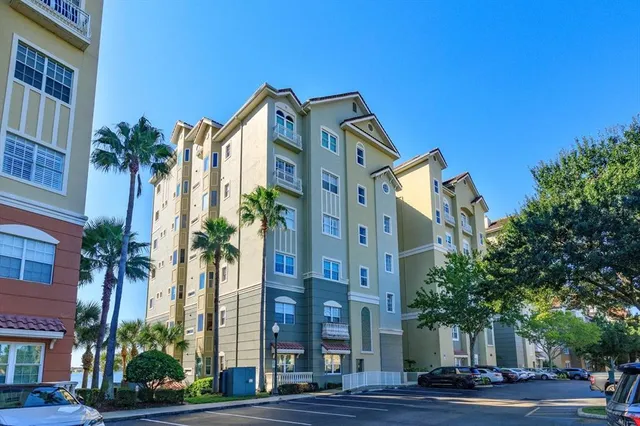 a view of a tall building next to a road
