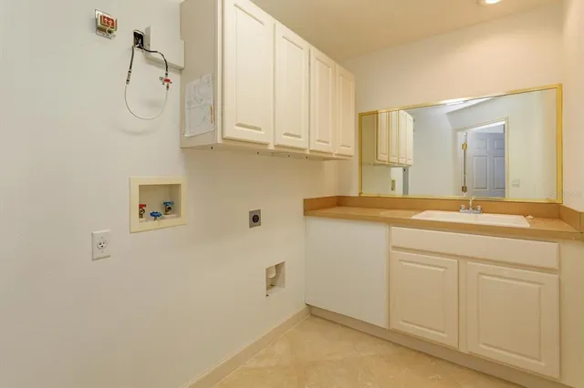 a bathroom with a sink and mirror