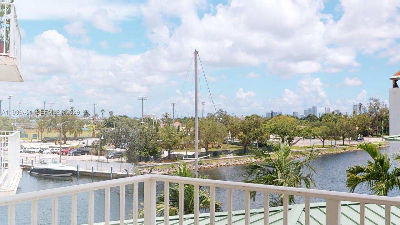 a view of a lake with a city skyline in the background