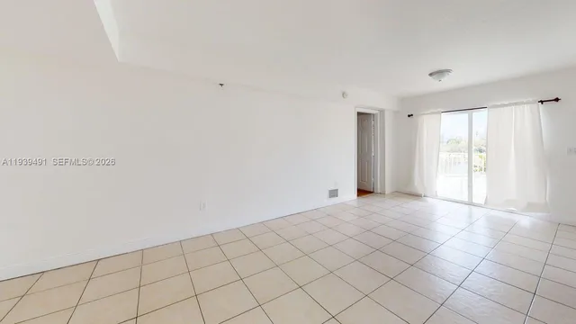 a view of an empty room and window