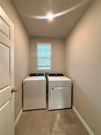 a utility room with dryer and washer