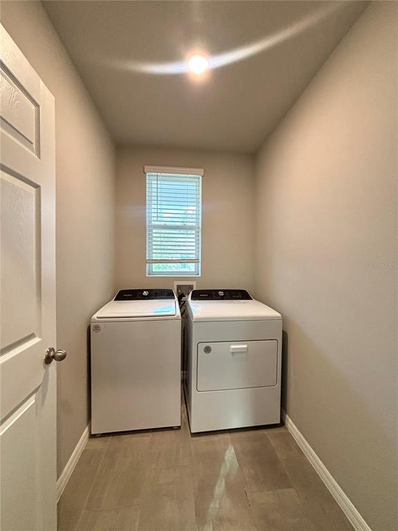 828 Rivers Crossing Street Clermont, FL 34714 - Photo 12 of 17 a utility room with dryer and washer
