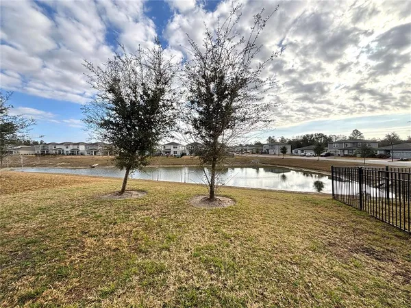 a view of a lake with a yard