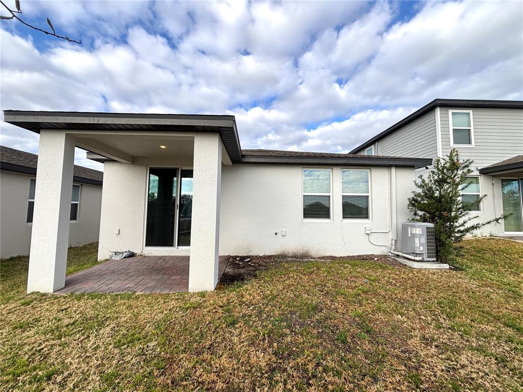 828 Rivers Crossing Street Clermont, FL 34714 - Photo 17 of 17 a front view of a house with a yard