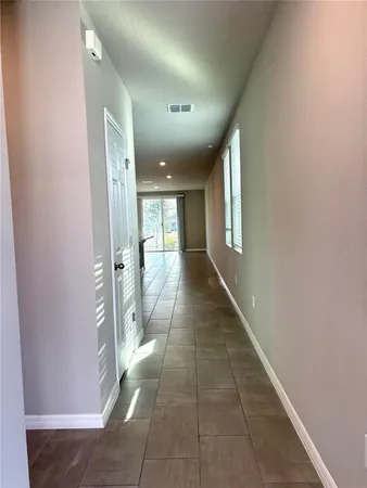 a view of a hallway with windows