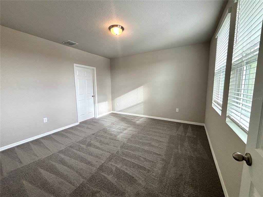 828 Rivers Crossing Street Clermont, FL 34714 - Photo 6 of 17 an empty room with windows