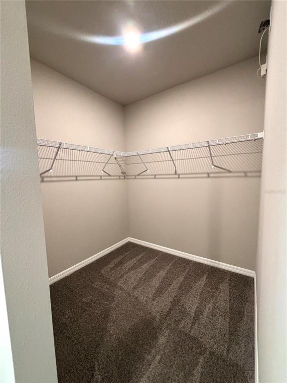 828 Rivers Crossing Street Clermont, FL 34714 - Photo 7 of 17 a view of a room with racks on the wall