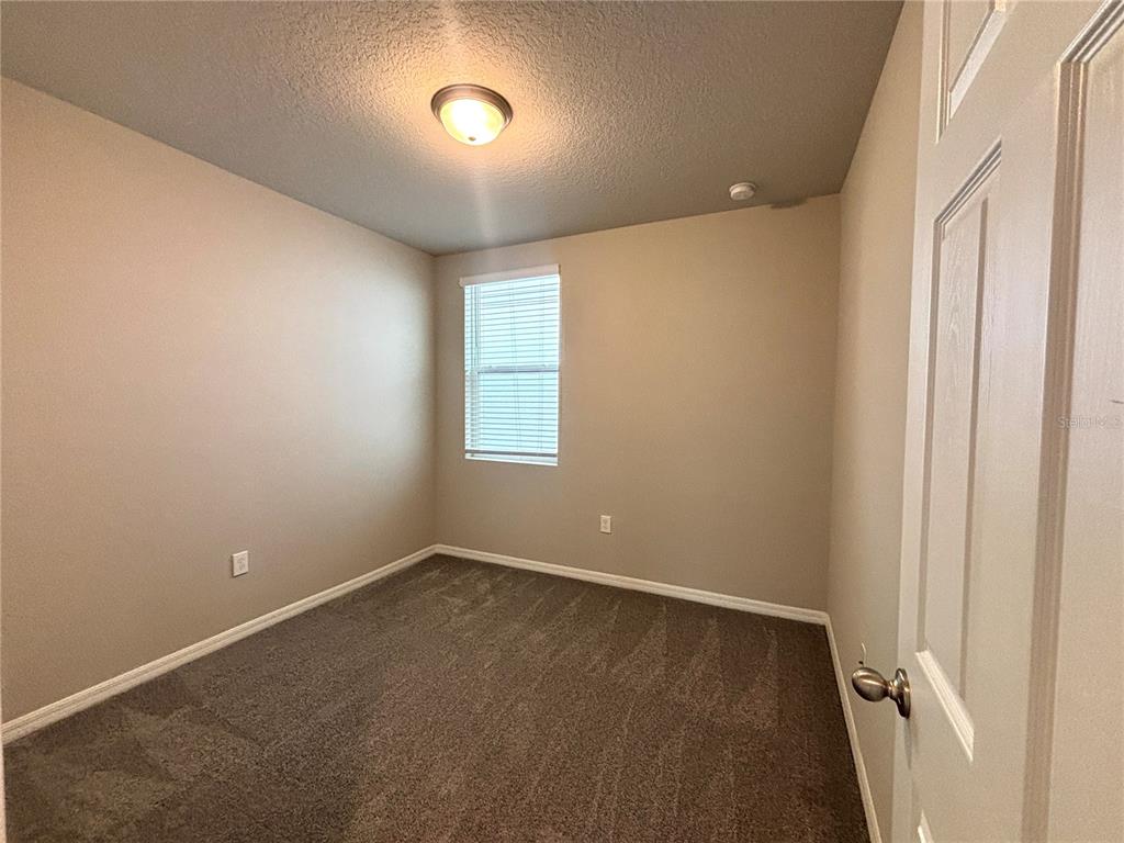 828 Rivers Crossing Street Clermont, FL 34714 - Photo 9 of 17 an empty room with a empty space and windows