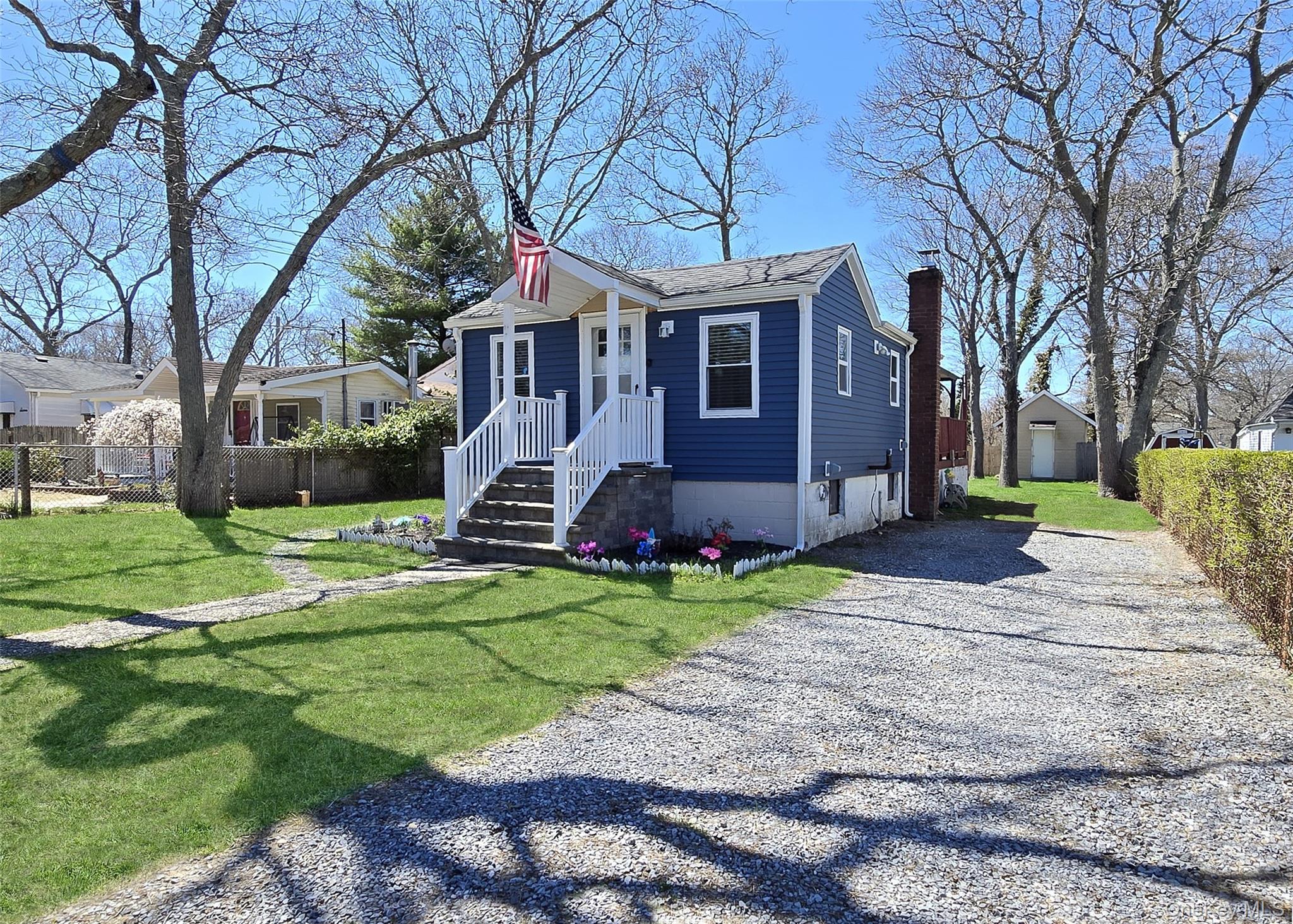 20 Daisy Place Selden, NY 11784 - Photo 1 of 13 a front view of a house with a yard and garage