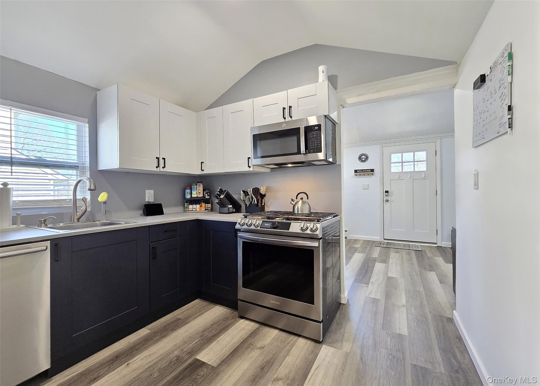 20 Daisy Place Selden, NY 11784 - Photo 4 of 13 a kitchen with stainless steel appliances granite countertop a stove a sink and a microwave
