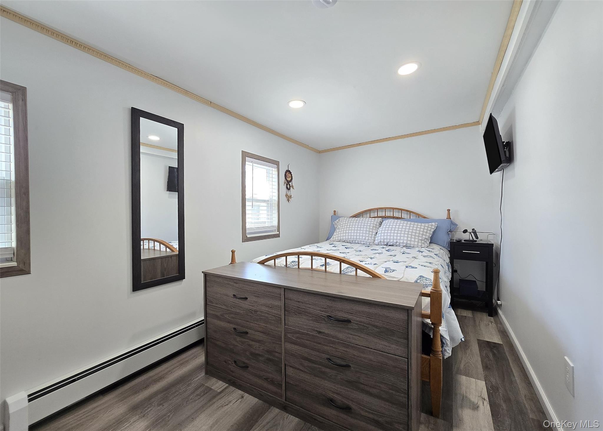 20 Daisy Place Selden, NY 11784 - Photo 7 of 13 a bedroom with a bed and a window