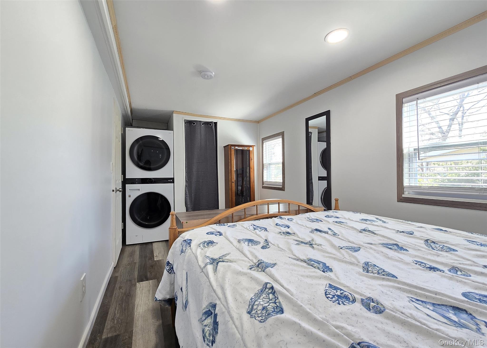20 Daisy Place Selden, NY 11784 - Photo 8 of 13 a bedroom with a bed and cabinets with a large window