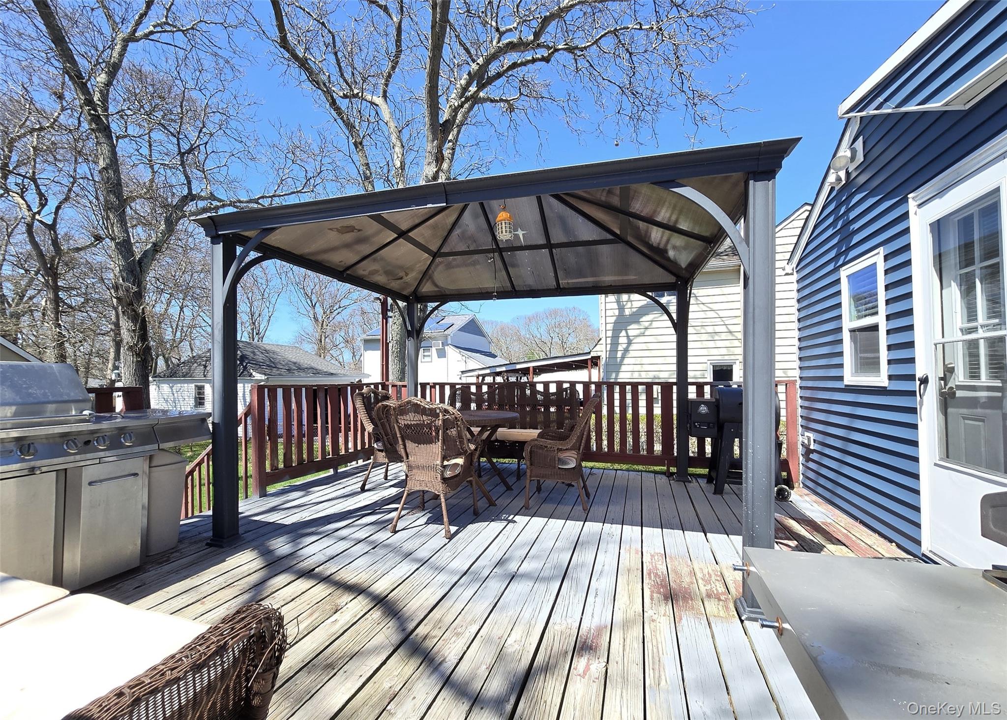 20 Daisy Place Selden, NY 11784 - Photo 10 of 13 a view of balcony with wooden floor and outdoor seating