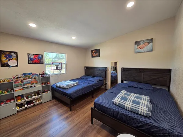 a view of a room with wooden floor and stairs