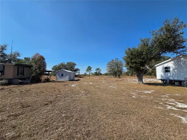 a view of a backyard of a house