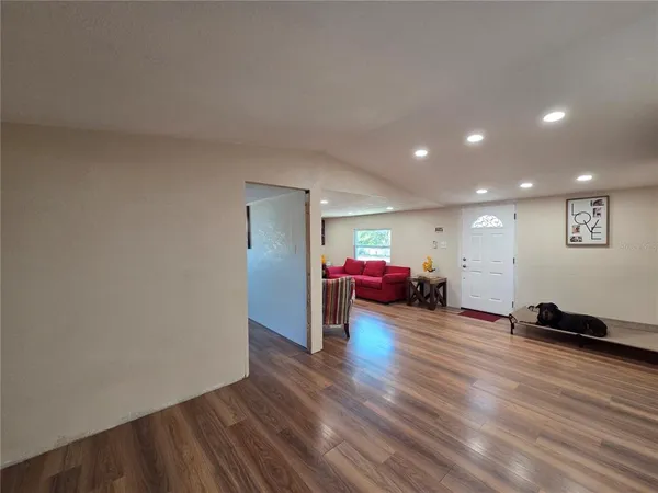 a kitchen with a table and chairs in it