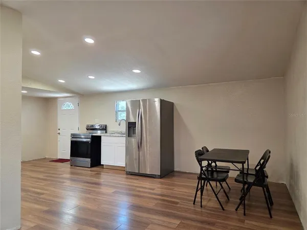 a kitchen with a stove microwave and refrigerator