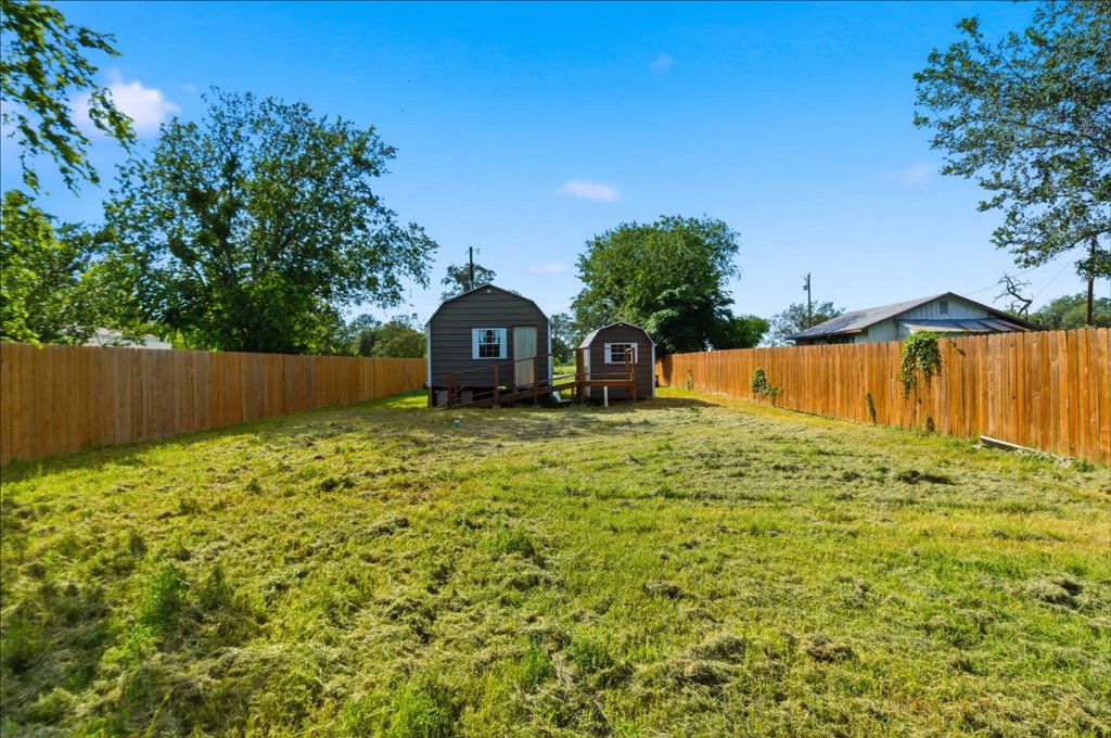 189 Watterson Road Bastrop, TX 78602 - Photo 19 of 22 3 side fenced backyard space and includes a back patio deck.