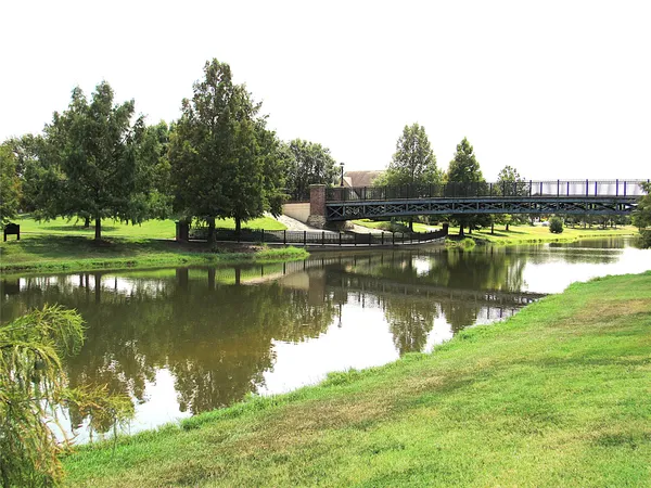 a view of a lake with houses in the back