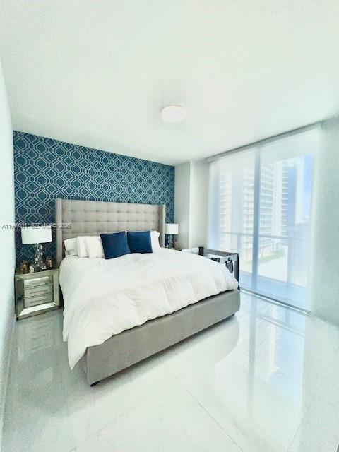 79 Southwest 12th Street, Unit 1806 Miami, FL 33130 - Photo 16 of 44 a bedroom with a large bed and a large window