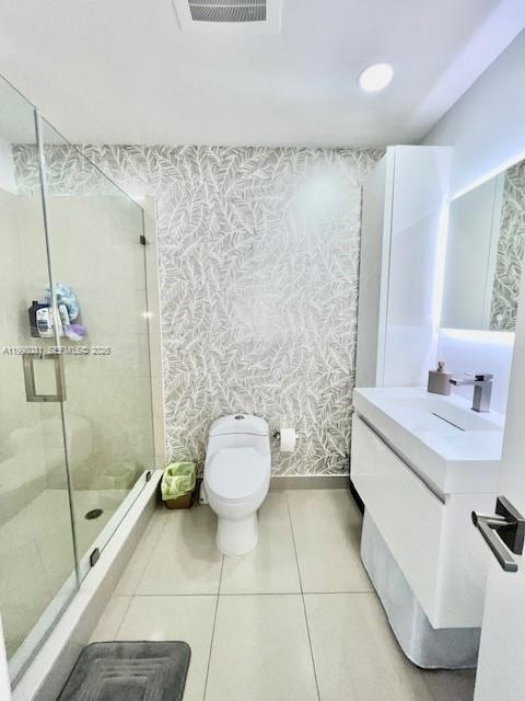 79 Southwest 12th Street, Unit 1806 Miami, FL 33130 - Photo 20 of 44 a bathroom with a toilet sink and shower