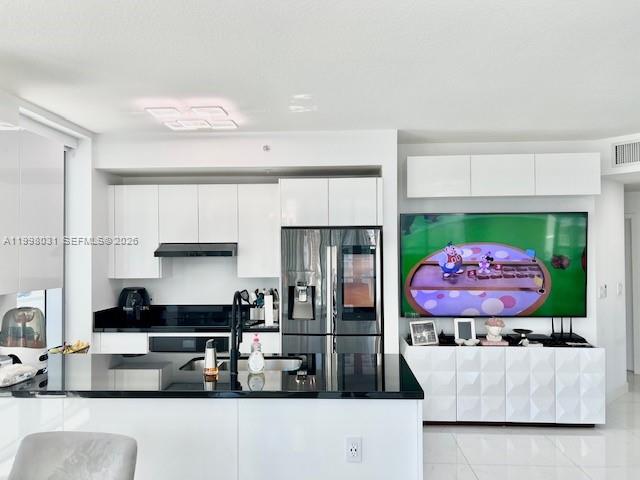 79 Southwest 12th Street, Unit 1806 Miami, FL 33130 - Photo 5 of 44 a kitchen with stainless steel appliances granite countertop a refrigerator and a stove