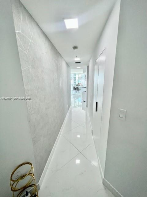 79 Southwest 12th Street, Unit 1806 Miami, FL 33130 - Photo 8 of 44 a view of a hallway