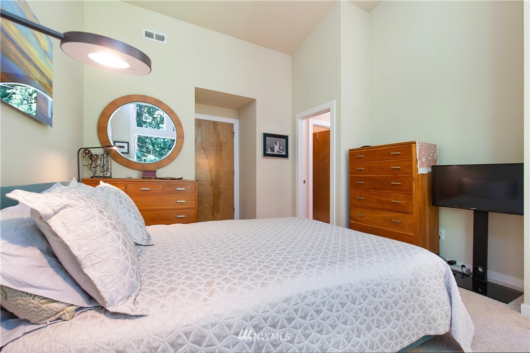 3200 Northeast 117th Street Seattle, WA 98125 - Photo 22 of 38 a bedroom with a bed and a dresser