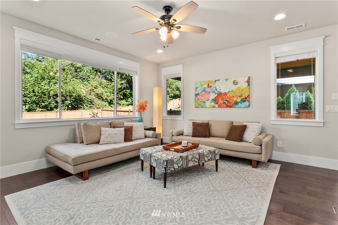 323 Field Place Southeast Renton, WA 98059 - Photo 14 of 40 a living room with furniture and a large window