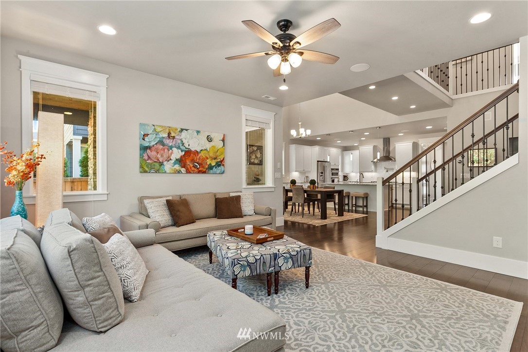 323 Field Place Southeast Renton, WA 98059 - Photo 15 of 40 a living room with furniture and a chandelier