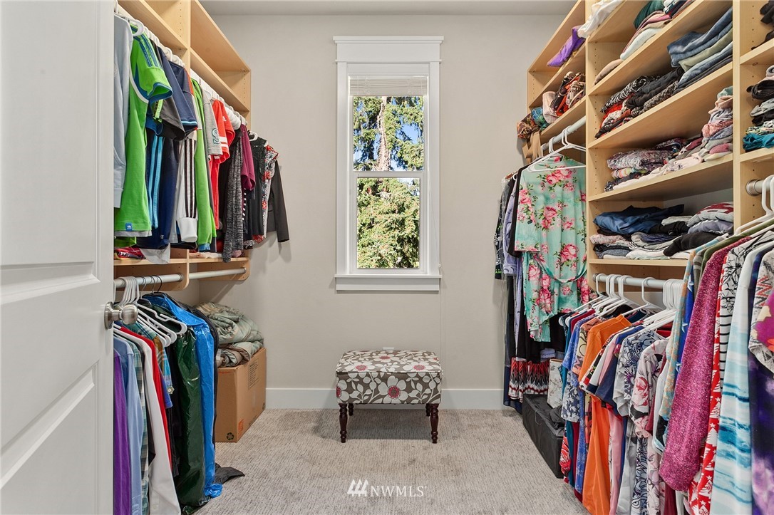 323 Field Place Southeast Renton, WA 98059 - Photo 23 of 40 a view of walk in closet with clothes and shoes
