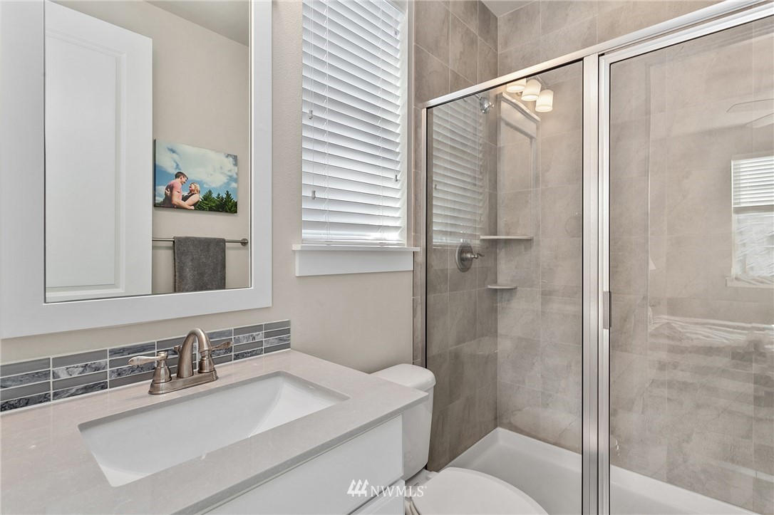 323 Field Place Southeast Renton, WA 98059 - Photo 27 of 40 a bathroom with a sink toilet and shower