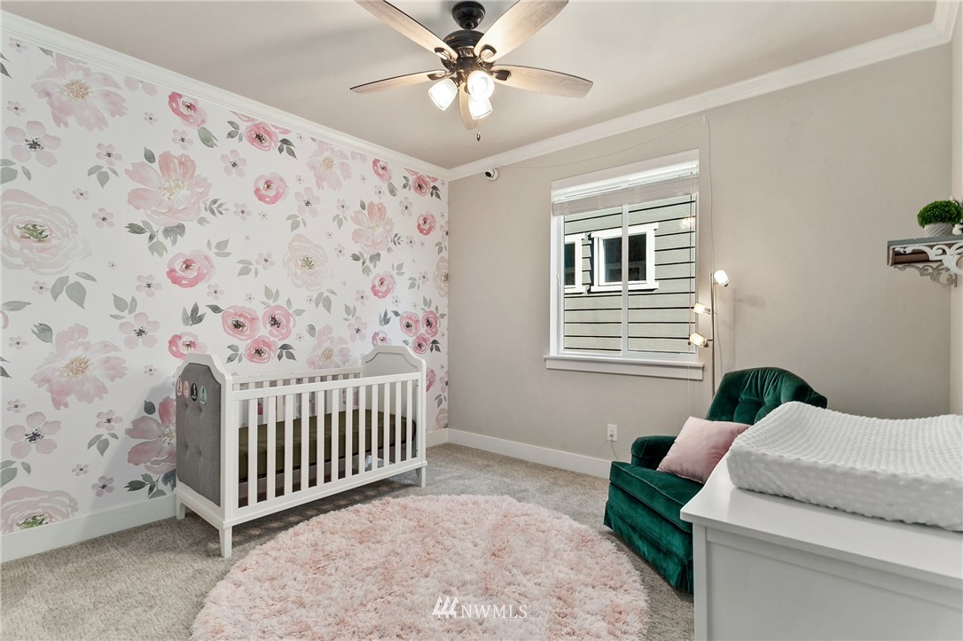 323 Field Place Southeast Renton, WA 98059 - Photo 28 of 40 a bedroom with a bed and a window