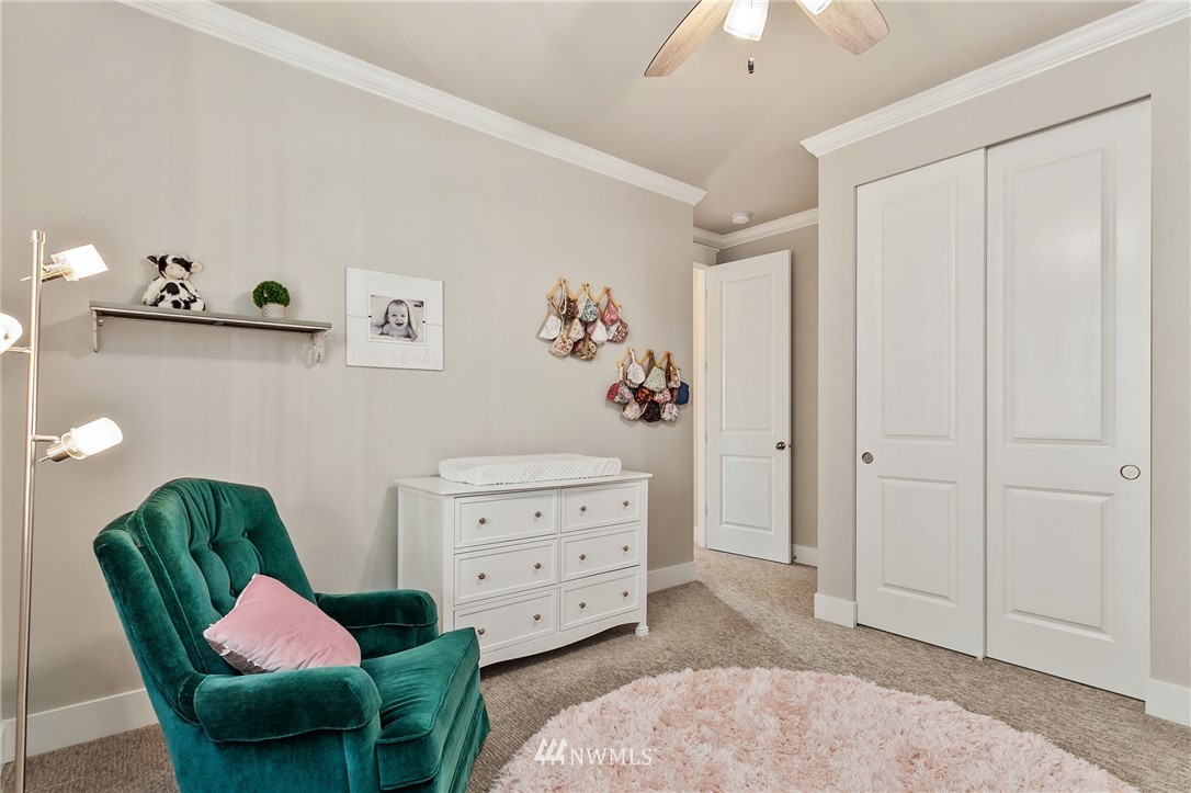 323 Field Place Southeast Renton, WA 98059 - Photo 29 of 40 a living room with furniture closet and a lamp