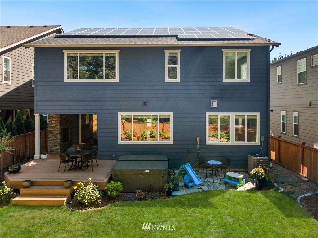 323 Field Place Southeast Renton, WA 98059 - Photo 36 of 40 a view of a house with backyard sitting area and furniture