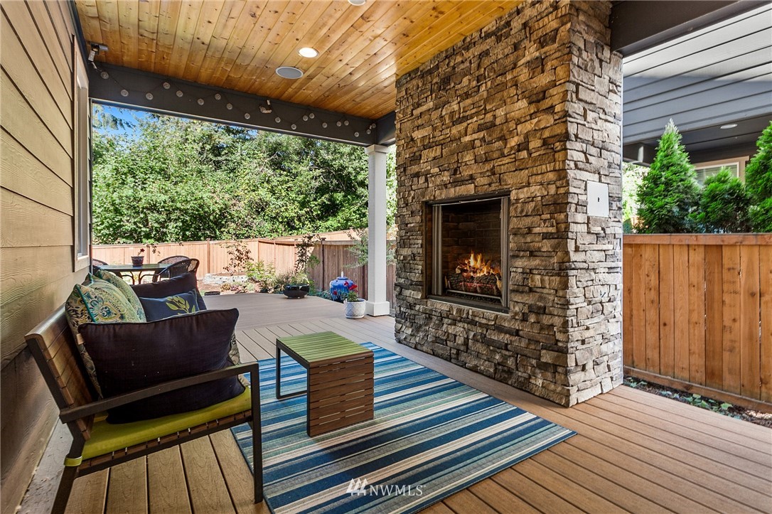 323 Field Place Southeast Renton, WA 98059 - Photo 8 of 40 a outdoor living space with furniture and a fireplace