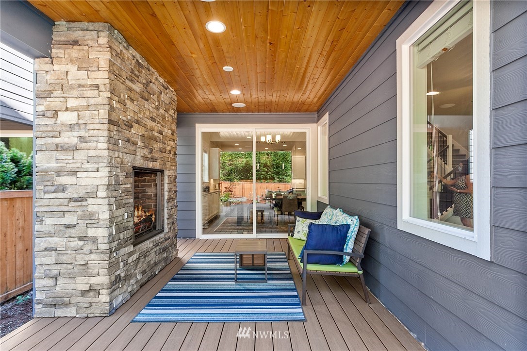 323 Field Place Southeast Renton, WA 98059 - Photo 10 of 40 a view of a two chairs in the balcony with wooden floor