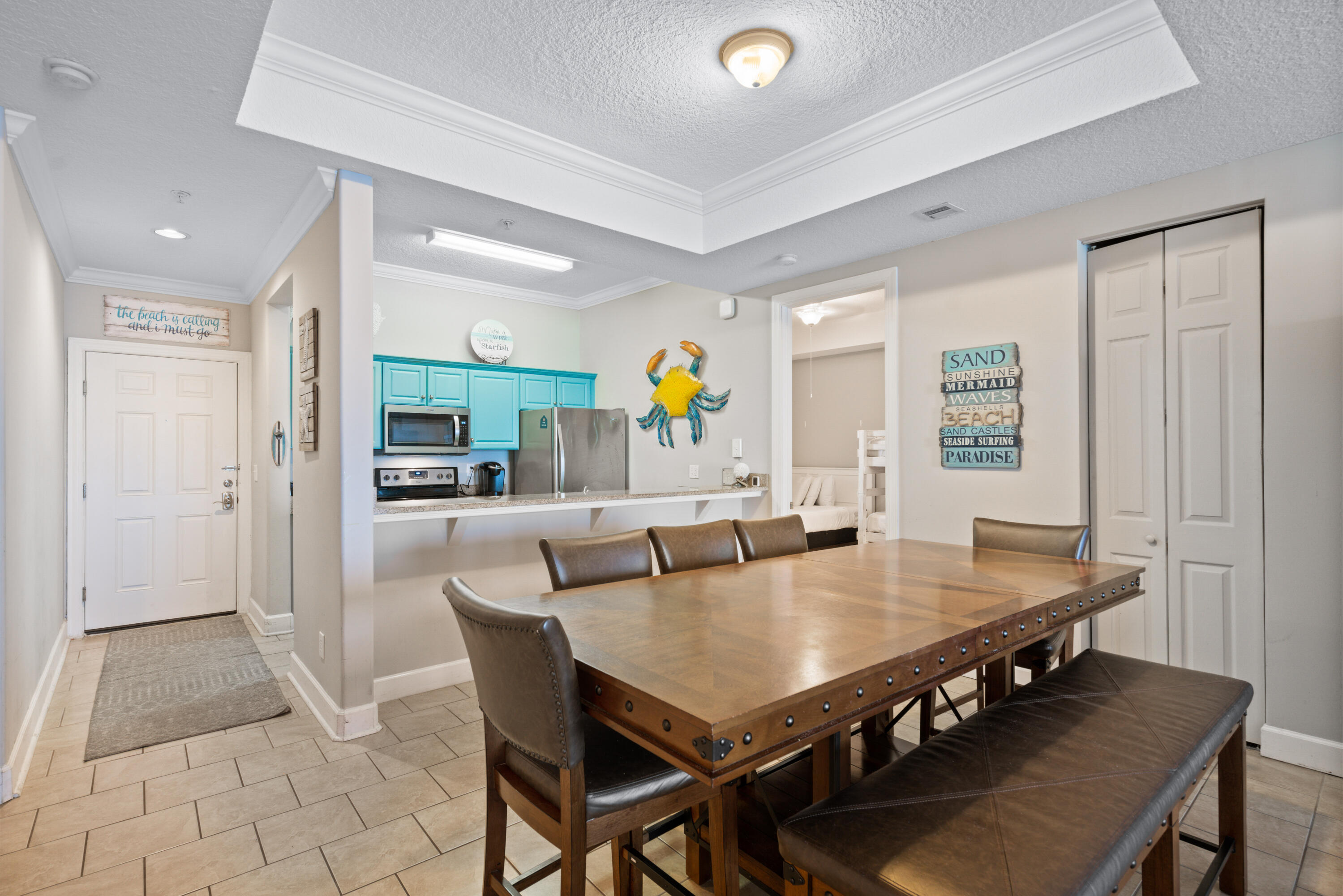 10611 Front Beach Road, Unit 2001 Panama City Beach, FL 32408 - Photo 11 of 49 a view of a dining room with furniture