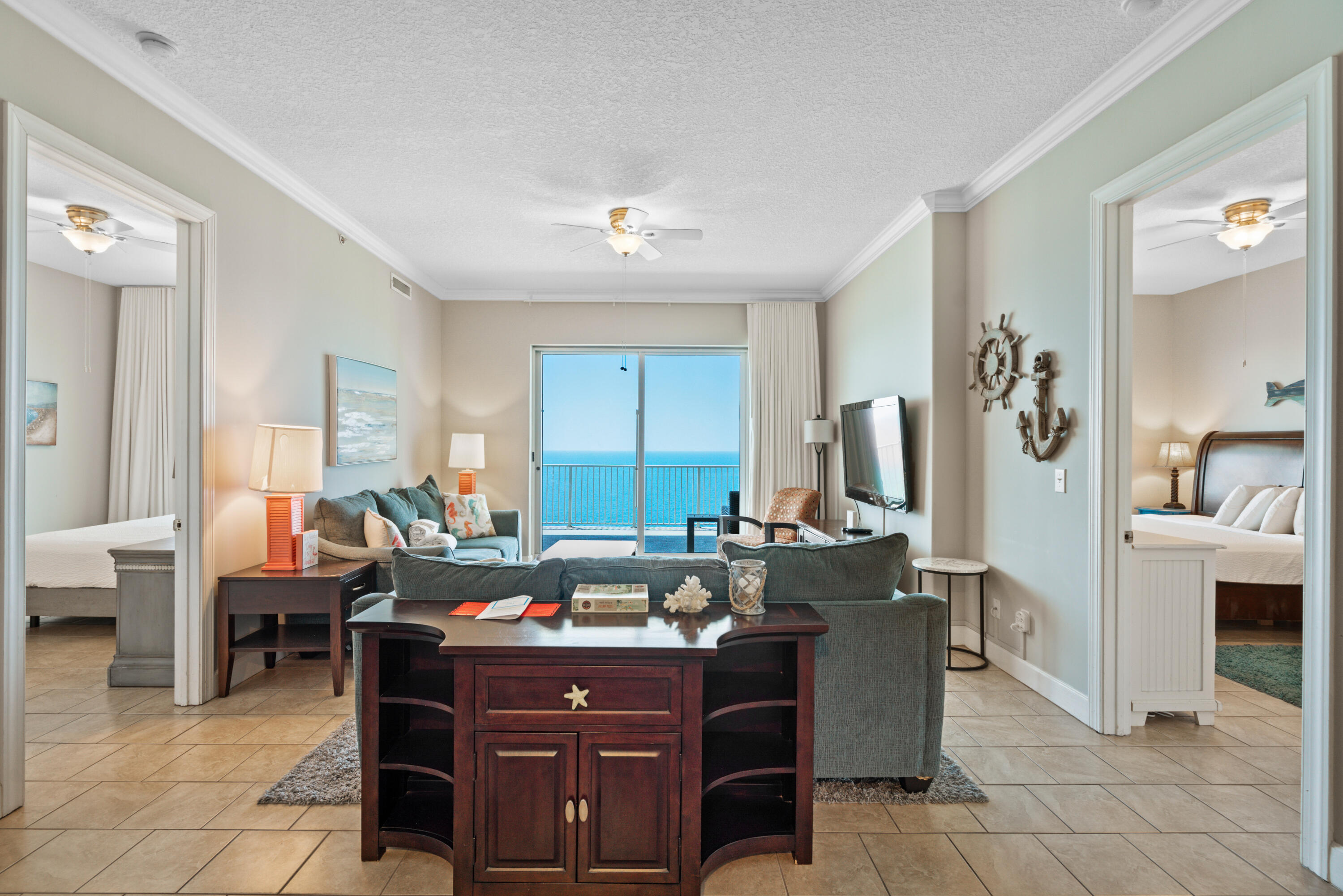 10611 Front Beach Road, Unit 2001 Panama City Beach, FL 32408 - Photo 15 of 49 a bed room with furniture and large windows