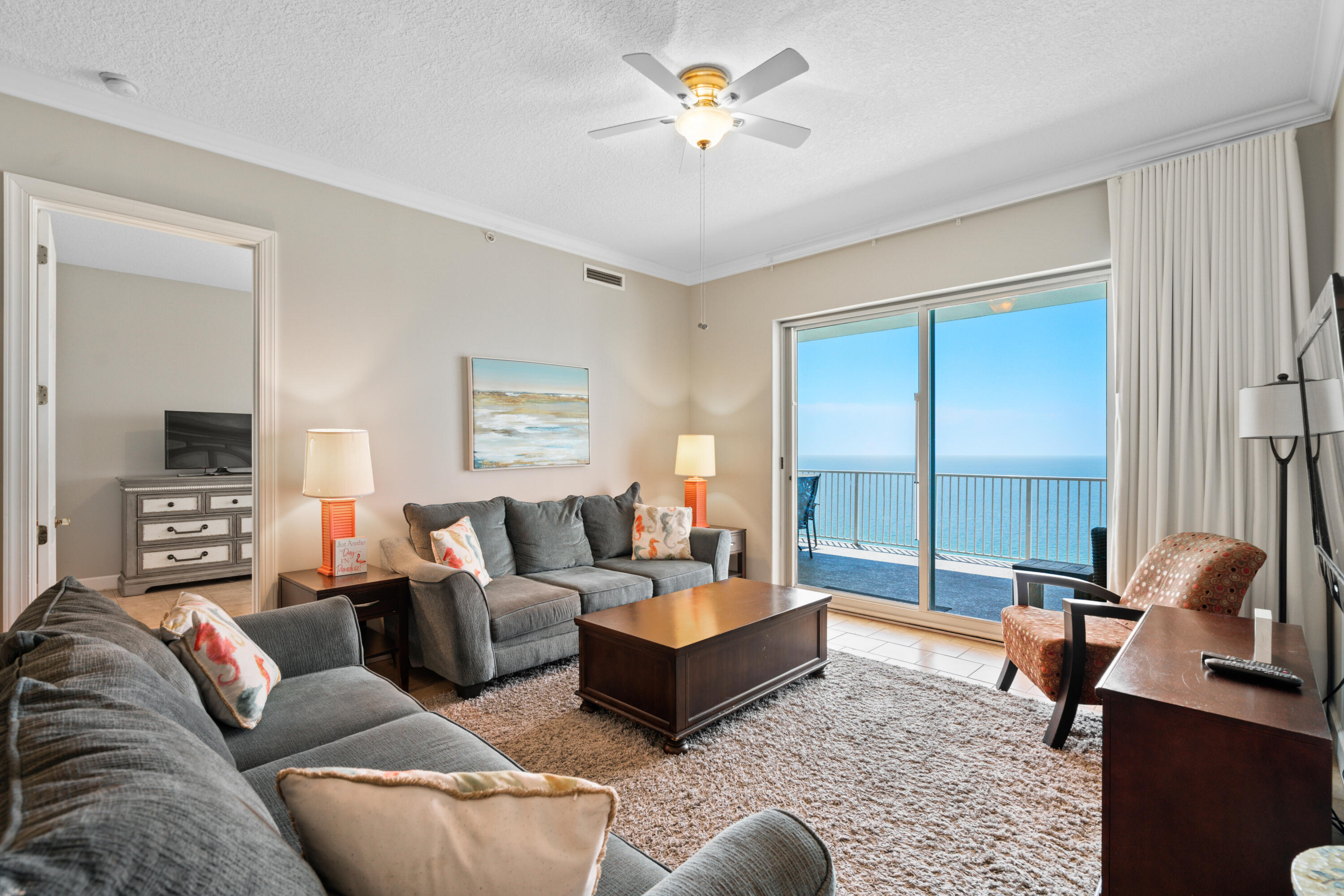 10611 Front Beach Road, Unit 2001 Panama City Beach, FL 32408 - Photo 17 of 49 a living room with furniture and a large window