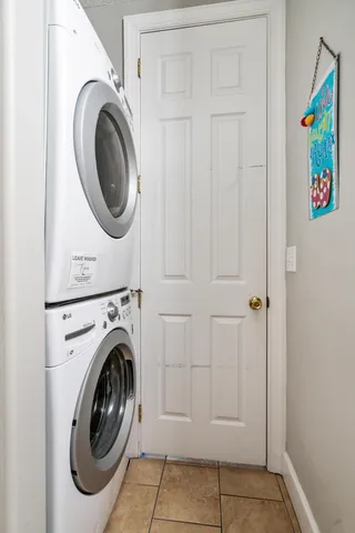 a bedroom with a bed and a ceiling fan