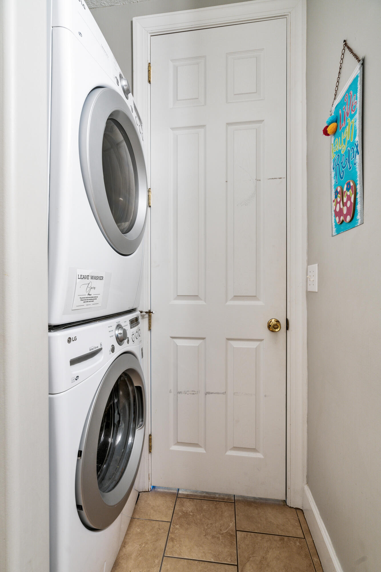 10611 Front Beach Road, Unit 2001 Panama City Beach, FL 32408 - Photo 31 of 49 a view of storage and utility room with washer and dryer