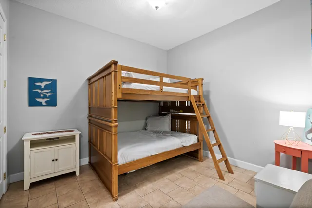 a bedroom with a bed and a view of walk in closet