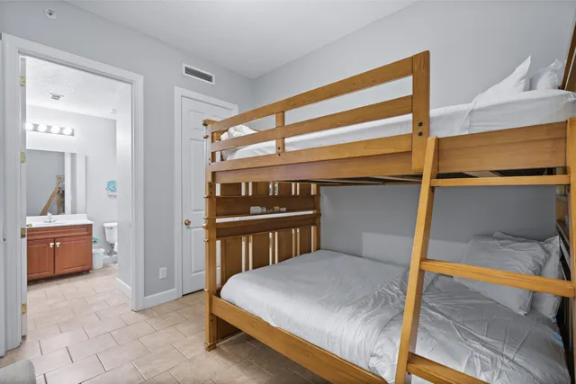 a bedroom with a bed and a table