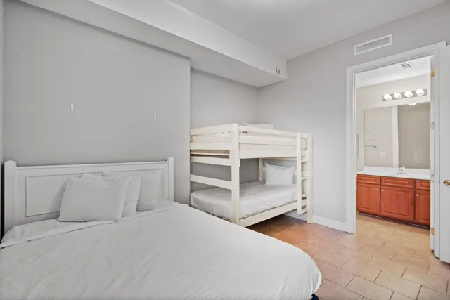 a bathroom with a sink a toilet a shower curtain and a mirror