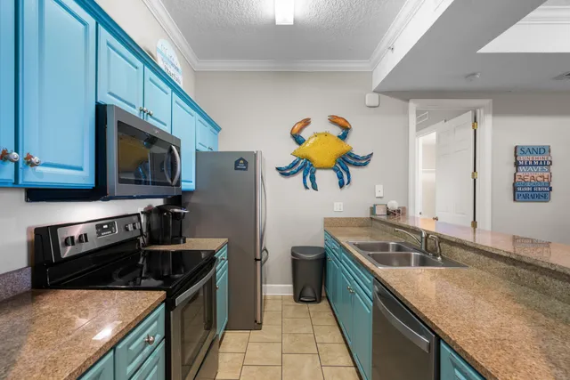 a kitchen with stainless steel appliances granite countertop a sink and a stove