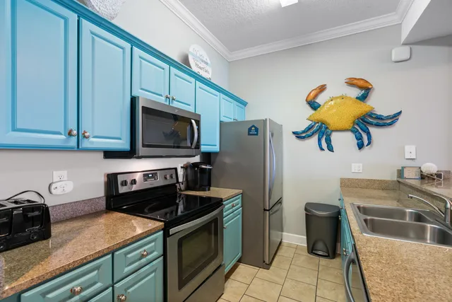 a kitchen with a sink and a refrigerator